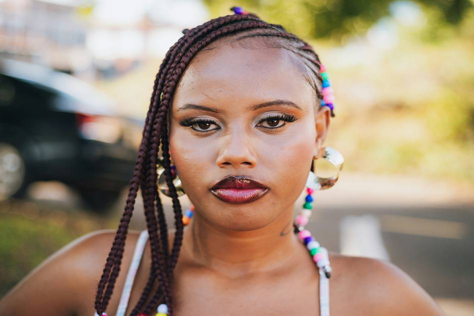 Woman showcasing natural-looking hair topper with soft waves
